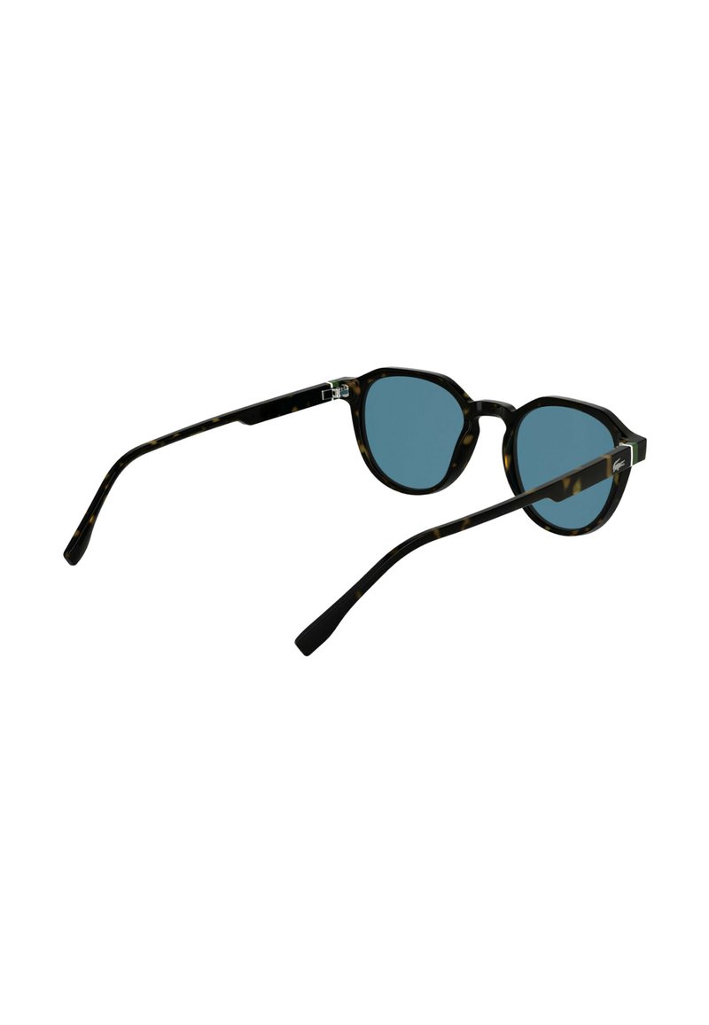 Lunettes de soleil écaille avec verres teintés bleus. Montures arrondies, branches fines noires. Design minimaliste avec des accents métalliques subtils.