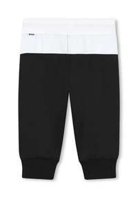 Joggeurs noirs avec une ceinture élastique blanche et un panneau supérieur contrastant blanc. Présente des poignets côtelés pour un look ajusté.
