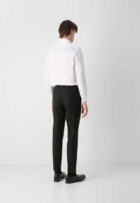 HUGO ARTI HESTEN SET - Gilet elegante - black