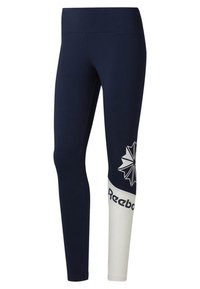 Högmidjade leggings i marinblått med vit panel. Har en stjärnexplosion-grafik och "Reebok"-logotyp i svart på underbenet.