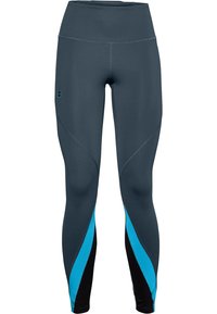 Sportleggings i mörkgrått med teal och svarta accenter. Tillverkade av ett elastiskt material, med hög midja och rundade sömmar.