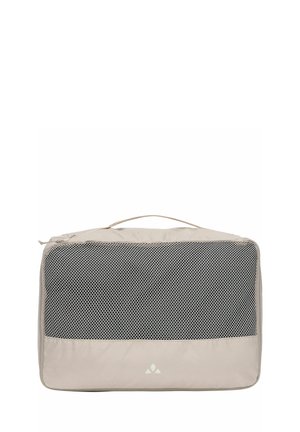 Beige rechteckiger Packwürfel mit Netzvorderseite und Tragegriff oben zur Reiseorganisation.