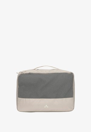 Beige rechteckiger Packwürfel mit Netzvorderseite und Tragegriff oben zur Reiseorganisation.