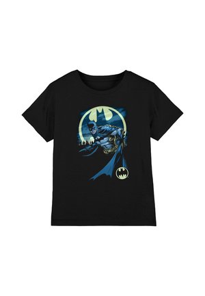 Black t-shirt with a graphic of Batman in blue and gray suit, reaching forward with a glowing bat symbol and city skyline in the background.