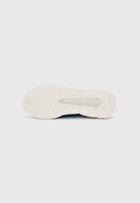 Blue athletic shoe sole with a textured white rubber outsole and zigzag tread pattern. Features brand name embossed on the side.