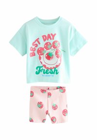 Tva-delad barnoutfit: mintgrön kortärmad skjorta med tomatgrafik och rosa shorts med upprepande tomatmönster. Tillverkad av bomull.