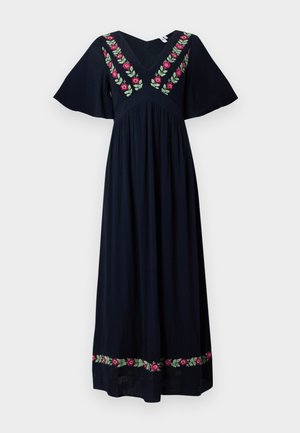 Fekete maxiruha bő ujjakkal, V-nyakkivágással, rózsaszín és zöld virágos hímzéssel a mellrészen és az alsó szegélyen.