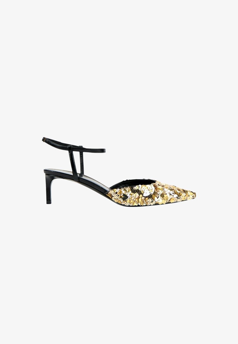 Chaussure noire à talon kitten à brides avec un bout pointu recouvert de sequins brillants dorés et argentés.
