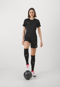 Nike Performance TOP BRANDED - Spordi T-särk - black/metallic gold