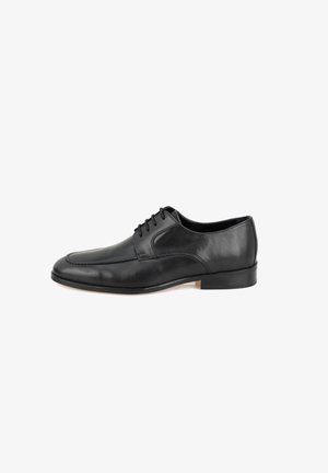 Black leather dress shoe with a rounded toe, lace-up front, and subtle stitching details. Features a low, sturdy heel. Smooth texture.