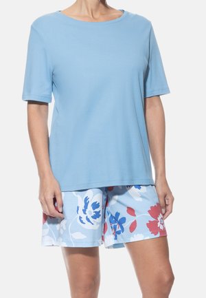 Light blue short-sleeve t-shirt with a round neckline paired with blue shorts featuring a floral pattern in red and white accents.