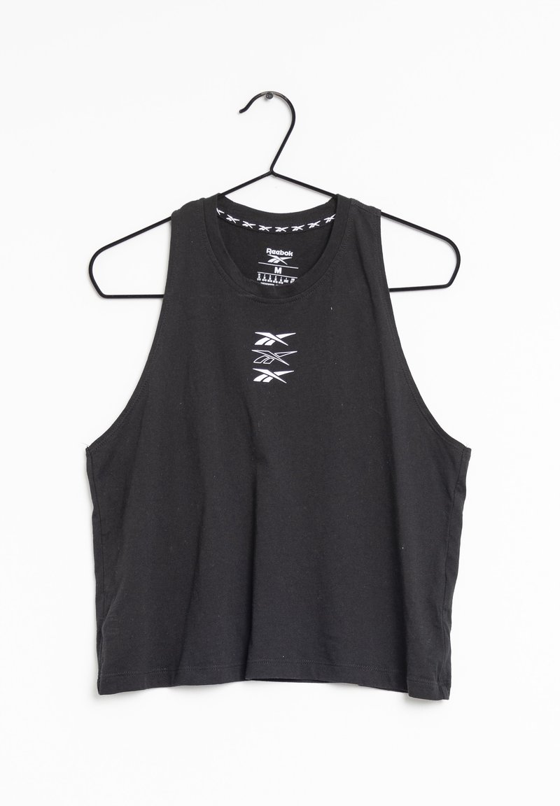 Crop top noir sans manches Reebok avec logo blanc centré sur la poitrine, suspendu sur un cintre métallique noir sur fond blanc.