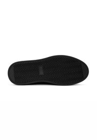 Suela de zapato negra con un patrón texturizado en zigzag; hecha de caucho, con una forma plana y sin logotipos ni marcas visibles.