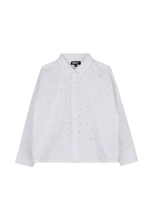 Chemise blanche à manches longues avec col et boutons sur le devant, décorée de petits points argentés éparpillés, étiquette DKNY à l'intérieur du col.