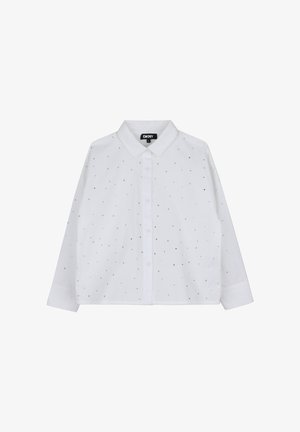 Chemise blanche à manches longues avec col et boutons sur le devant, décorée de petits points argentés éparpillés, étiquette DKNY à l'intérieur du col.