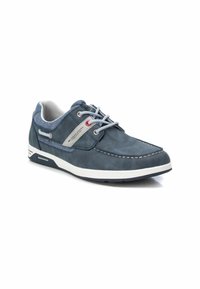 Zapato de cuero azul con suela blanca, costuras grises y acentos blancos. Presenta un diseño de cordones y una lengüeta texturizada.