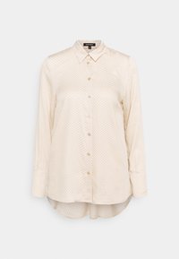 Cream-colored long-sleeve blouse with a subtle geometric pattern, button-up front, and rounded hem. Made from smooth fabric.