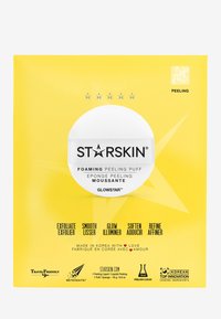 Emballage jaune avec un design d'étoile. Nom du produit "STARSKIN" en noir, centré sur un cercle blanc. Le texte énumère les avantages dans plusieurs langues.
