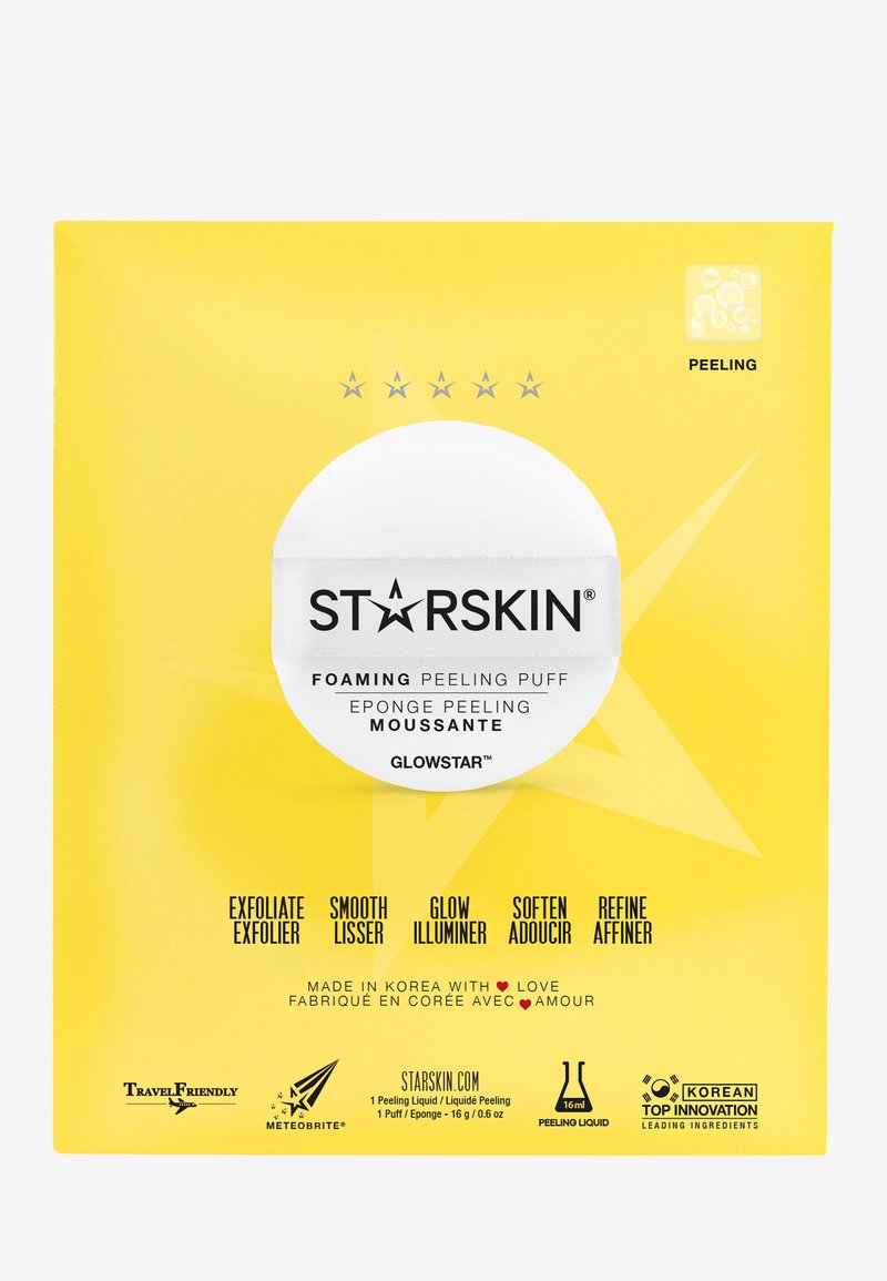 Emballage jaune avec un design d'étoile. Nom du produit "STARSKIN" en noir, centré sur un cercle blanc. Le texte énumère les avantages dans plusieurs langues.