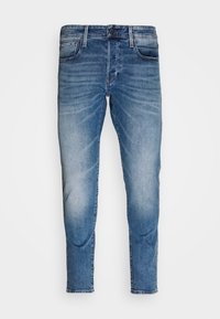 Ljust blå denimjeans med rak passform, blekt mönster, sömnadsdetaljer, fem fickor och dragkedja med knappstängning.
