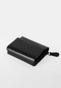 Black leather wallet with a rectangular shape, zippered closure, embossed logo detail, and smooth texture. Compact and versatile design.