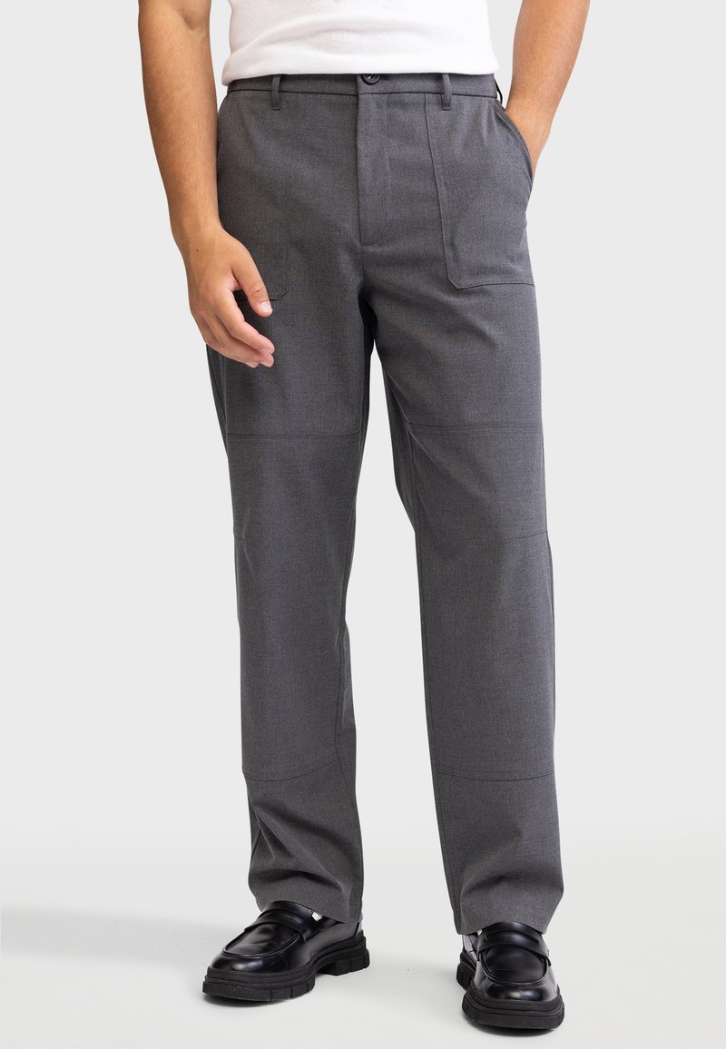 Gray tailored pants with a smooth fabric finish, featuring two front pockets and a straight leg design. Worn with black shoes.