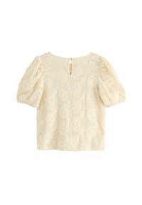 Kreemi tekstureeritud pluus puffvarrukatega, lillekiri, võtmeaugu tagune detail ja pehme, õrn kangas. Üksik sile viimistlus.