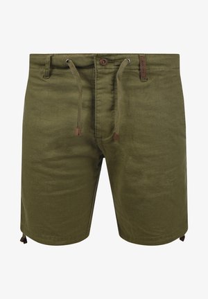 Olívazöld sort puha anyagból, melynek derékpántja zsinórral állítható, gombos záródású, és barna díszítéssel rendelkezik a derékpántnál és az alján.