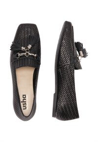 Loafers negri țesute, cu talpă plată, accente decorative cu ciucuri și un detaliu metalic în față. Suprafață texturată pentru aderență.
