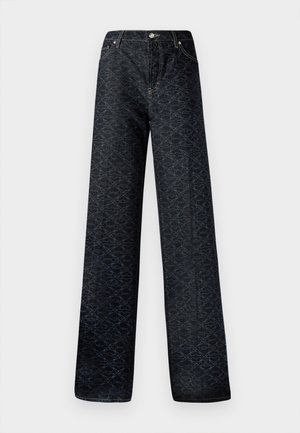 Jean large bleu foncé avec un motif géométrique, en denim. Présente un bouton en métal, une fermeture éclair et des coutures de poches avant.
