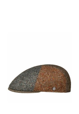 Flat tweed cap with two-tone herringbone pattern in gray and brown, featuring a small round metal brand emblem on the side.