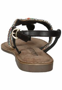 Bruine leren sandaal met kralenaccenten, gespsluiting, platte zool en zachte, textuurgevoelige inlegzool. Ontwerp met open achterkant en decoratieve stiksels.