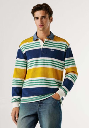 Meer gekleurd rugbyshirt met horizontale strepen in blauw, geel, wit en groen. Voorzien van een blauwe kraag en witte manchetten.