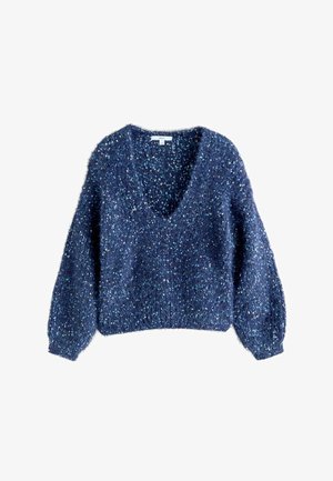 Tömött, tengerészkék pulóver, V-kivágással, hosszú, ballon ujjakkal, és egy textúrált, bolyhos anyagból, amely színes pöttyökkel van átszőve.