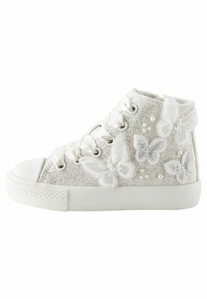 White high-top sneaker with glitter, satin laces, fabric butterflies, and small pearl embellishments on the side.