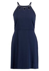 Mörkblå ärmlös klänning med tunna band och triangulära utskärningar längs halsringningen med ljus färg på kanterna.