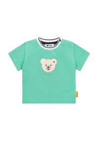 Camiseta de algodón turquesa de manga corta con un aplique de cara de oso en la parte delantera y un cuello a rayas en blanco y negro. Etiqueta en el costado.