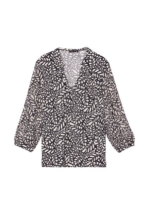 Blouse à motifs noirs et blancs avec un col en V, des manches trois-quarts et un tissu léger et transparent présentant un design de feuilles.
