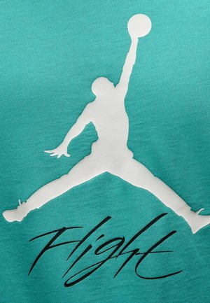 Türkisfarbiges Gewebe mit einer großen weißen Silhouette eines Basketballspielers, der springt, um zu dunkeln, mit schwarzem Text „Flight“ darunter.