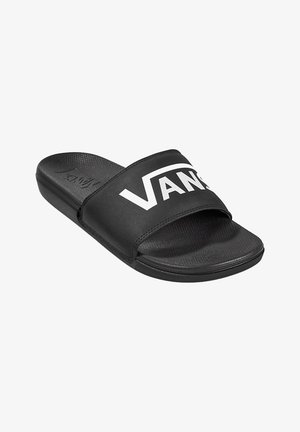 Sandalo slide nero con una larga fascia caratterizzata da un grande logo "VANS" bianco. Sottopiede testurizzato e suola in gomma liscia.