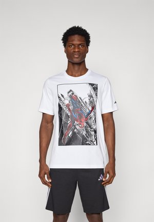 White cotton t-shirt featuring a large black and red Spider-Man graphic, set against a city backdrop. Includes short sleeves and round neckline.