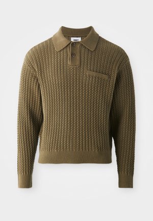 Knit sweater in olive green with a textured pattern, a collared neck, and three-button placket. Features ribbed cuffs and hem.