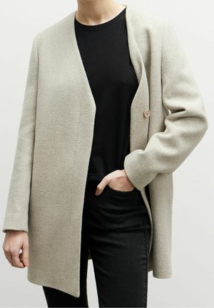 Halflange jas - beige
