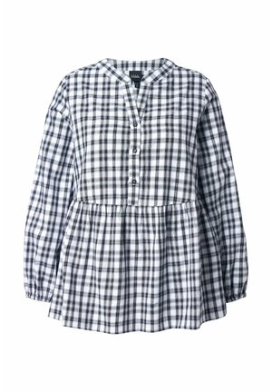 Valkoinen ja musta ruudullinen pitkähihais blouse, jossa on kolme nappia edessä ja ryppyinen vyötäröyksityiskohta.