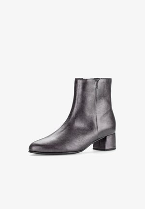 Black leather ankle boot with a pointed toe and a chunky heel. Smooth texture with a sleek design and minimal stitching details.