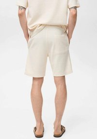 Mango XAVIS - Teplákové kalhoty - off-white
