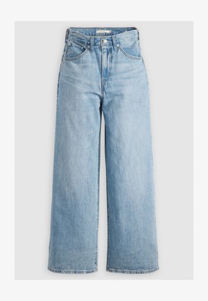 Jean ample bleu clair en denim, avec une taille haute, cinq poches et des coutures contrastantes. Texture lisse avec un léger délavage.