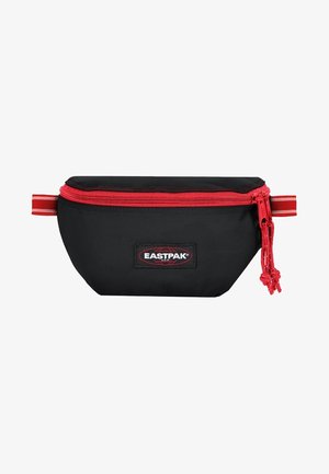 Pochette en tissu noir avec fermeture éclair rouge et accents assortis, forme arrondie, patch logo Eastpak sur le devant, présentant des coutures solides et une surface texturée.