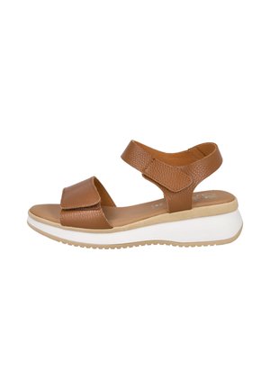 Sandalia de cuero marrón con punta abierta, con correas ajustables y suela plataforma blanca acolchada, diseñada para uso casual.