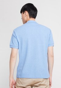 Lacoste Polokošeľa - ipomee chine